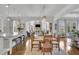 Open dining area features hardwood floors, an ornate light fixture, and views into the living room at 1366 Kings Park Nw Dr, Kennesaw, GA 30152