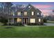 Inviting home with a covered porch, perfect for relaxing and enjoying the outdoors at 1366 Kings Park Nw Dr, Kennesaw, GA 30152