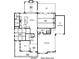 Detailed first floor plan showcasing the layout with kitchen, breakfast room, and garages at 1366 Kings Park Nw Dr, Kennesaw, GA 30152