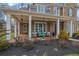 Charming front porch with comfortable seating and decorative lighting at 1366 Kings Park Nw Dr, Kennesaw, GA 30152