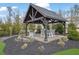 Outdoor gazebo features a fire pit with seating and string lights at 1366 Kings Park Nw Dr, Kennesaw, GA 30152