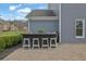 Outdoor bar featuring granite countertop, seating for four, and a stone paver patio at 1366 Kings Park Nw Dr, Kennesaw, GA 30152