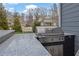 Outdoor kitchen featuring a stainless steel grill with granite countertops and a tiled backsplash at 1366 Kings Park Nw Dr, Kennesaw, GA 30152
