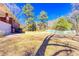 Expansive backyard with a well-kept lawn, bordered by trees, offering ample space for recreation at 1650 Seayes Sw Rd, Mableton, GA 30126
