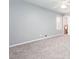 Spacious bedroom with soft gray walls, plush carpeting, a ceiling fan, and a window for natural light at 1650 Seayes Sw Rd, Mableton, GA 30126
