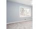 Bright bedroom features a ceiling fan and a large window for natural light at 1650 Seayes Sw Rd, Mableton, GA 30126