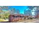 Charming brick home with blue shutters and a well-maintained front yard, offering classic curb appeal at 1650 Seayes Sw Rd, Mableton, GA 30126