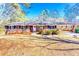 Charming brick home with a welcoming front yard and covered carport, perfect for outdoor living at 1650 Seayes Sw Rd, Mableton, GA 30126