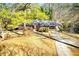 Charming brick home with well-maintained landscaping, inviting carport, and a welcoming entryway, perfect for comfortable living at 1650 Seayes Sw Rd, Mableton, GA 30126