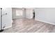 Open floor plan featuring a ceiling fan, wood grain floors, and soft gray walls at 1650 Seayes Sw Rd, Mableton, GA 30126