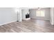 Inviting space features wood grain flooring, white brick fireplace, and soft gray walls at 1650 Seayes Sw Rd, Mableton, GA 30126