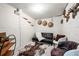 Basement living room space features a unique decor, carpeted floors and black leather futon at 2140 Meador Se Ave, Atlanta, GA 30315