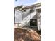 View of the house's rear exterior showcasing a sliding door and a cozy concrete patio at 2021 Austin Park Cir, Decatur, GA 30032