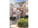 Brick townhome featuring a cozy entryway and well-maintained front yard at 2021 Austin Park Cir, Decatur, GA 30032