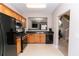 Kitchen view showing stainless steel appliances, cabinets, and view into living area at 2021 Austin Park Cir, Decatur, GA 30032
