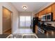 Kitchen view with stainless steel appliances, window, and access to other rooms at 2021 Austin Park Cir, Decatur, GA 30032