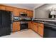 Kitchen featuring stainless steel appliances, wood cabinets, and sleek countertops at 2021 Austin Park Cir, Decatur, GA 30032