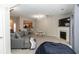 Inviting living room featuring a cozy fireplace, dining area, and ample natural light from sliding doors at 2021 Austin Park Cir, Decatur, GA 30032