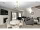 Bright living room with neutral tones, a fireplace, dining table, and sliding doors to the backyard at 2021 Austin Park Cir, Decatur, GA 30032