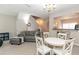 Comfortable living room with neutral decor, a fireplace, dining area, and an open view to the kitchen at 2021 Austin Park Cir, Decatur, GA 30032