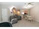 Comfortable living room with neutral decor, a fireplace, dining area, and an open view to the kitchen at 2021 Austin Park Cir, Decatur, GA 30032