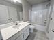 Modern bathroom with granite countertop, tile flooring and shower-tub combo at 1312 Fern Ridge Ct # 78, Norcross, GA 30093