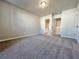 Spacious bedroom with neutral carpet, ensuite bathroom and ample closet space at 1312 Fern Ridge Ct # 78, Norcross, GA 30093