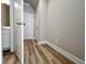 Small hallway with wood-look floors and multiple doors at 1312 Fern Ridge Ct # 78, Norcross, GA 30093