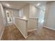 Upstairs hallway with carpet flooring and access to bedrooms and bathrooms at 1312 Fern Ridge Ct # 78, Norcross, GA 30093