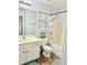 Bright bathroom featuring a single vanity and tub with shower at 235 Windcroft Nw Ln, Acworth, GA 30101