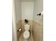 Efficient bathroom featuring toilet, storage, and neutral decor accents at 235 Windcroft Nw Ln, Acworth, GA 30101