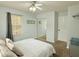 Bedroom with carpet, a ceiling fan, and mirrored closet doors at 235 Windcroft Nw Ln, Acworth, GA 30101