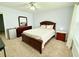 Bedroom features carpet, a ceiling fan, and an assortment of furniture at 235 Windcroft Nw Ln, Acworth, GA 30101