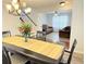 View of a dining room showcasing chandelier lighting, a staircase and access to the adjacent living area at 235 Windcroft Nw Ln, Acworth, GA 30101