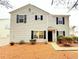 Charming two-story home featuring black shutters and manicured landscaping at 235 Windcroft Nw Ln, Acworth, GA 30101