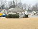 Attractive white gazebo with a seating area surrounded by green shrubbery in a grassy common area at 235 Windcroft Nw Ln, Acworth, GA 30101