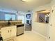 Bright kitchen view showing an eat-in breakfast bar with a view of the living room and fireplace at 235 Windcroft Nw Ln, Acworth, GA 30101