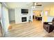 Cozy living room featuring a fireplace and an adjacent dining area with natural light at 235 Windcroft Nw Ln, Acworth, GA 30101