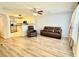 Open living room showcasing hardwood floors and seamlessly connected kitchen area at 235 Windcroft Nw Ln, Acworth, GA 30101