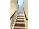 View of the staircase highlighting the dark wood and white combination at 235 Windcroft Nw Ln, Acworth, GA 30101