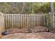 Fenced backyard with small statue and decorative elements, perfect for outdoor enjoyment at 2551 Bradford Ne Sq, Atlanta, GA 30345