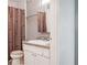 Traditional bathroom featuring a sink, toilet, and a shower curtain with a neutral color scheme at 2551 Bradford Ne Sq, Atlanta, GA 30345
