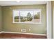 Bedroom showcasing a large window with natural light and a view of mature trees at 2551 Bradford Ne Sq, Atlanta, GA 30345