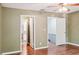 A bedroom with wood floors, access to the bathroom and the hallway at 2551 Bradford Ne Sq, Atlanta, GA 30345