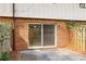 Back patio with sliding glass doors leading inside the brick home at 2551 Bradford Ne Sq, Atlanta, GA 30345