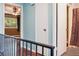 Upstairs hallway with hardwood floors, a ceiling fan, and access to the bedrooms and bathroom at 2551 Bradford Ne Sq, Atlanta, GA 30345