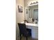 Bathroom featuring a white vanity, well-lit mirror, and neutral decor at 3148 Glenloch Pl, Lawrenceville, GA 30044