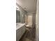 Bathroom featuring a single vanity, a tub/shower combo with patterned curtain, and neutral decor at 3148 Glenloch Pl, Lawrenceville, GA 30044