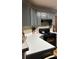 Close up of the modern eat-in kitchen features stainless steel range and ample counter space at 3148 Glenloch Pl, Lawrenceville, GA 30044