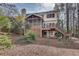 Charming home exterior with a screened porch and deck overlooking the backyard at 775 Hales Trace Sw Way, Lilburn, GA 30047